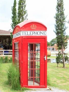 Single red phone box Stock Photos