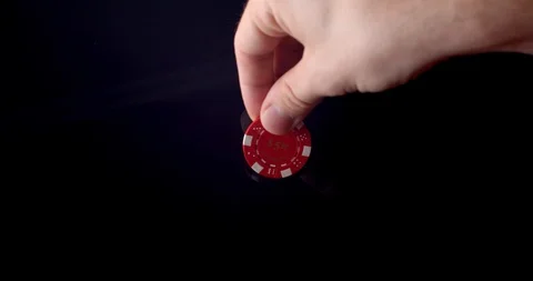 Single Red poker chip place on black background Stock Footage 112332285