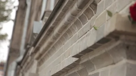 A single red rose adorns the stone ledge homes Video stock 64290755