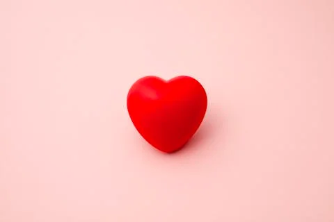 Single Red Rubber or 3D Heart Isolated on Pink Background Stock Photos