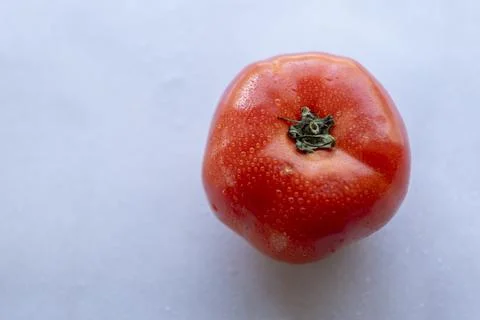 Single Red Tomato with Dew Drops from Above Fresh Organic Food Stock Photos