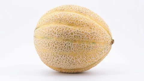 Single ripe cantaloupe rotating, (loopable) on white background. Stock Footage 113667200