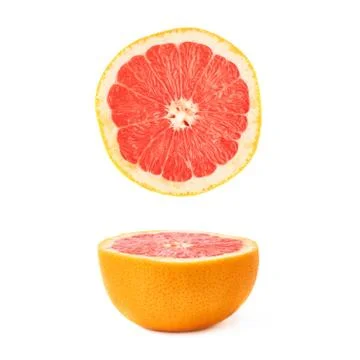 Single ripe grapefruit cut in half isolated over the white background Stock Photos