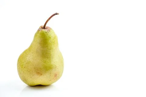 Single ripe pear with stem on a clean white background, studio shot 스톡 사진