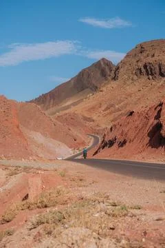 Single road through the mountains in Dades Gorge Morocco during sunset Stock Photos