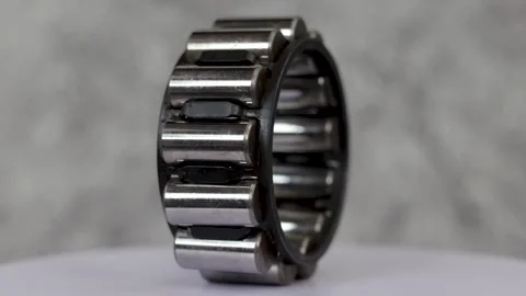 Single row cylindrical roller bearing assembly rotating on display. Stock Footage 344798705