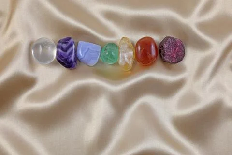 Single row of the Seven chakra healing crystal  Stock Photos