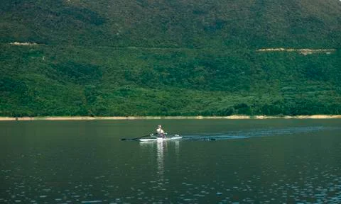 Single rower at sunrise Stock Photos