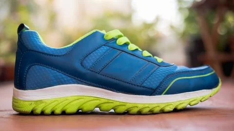 Single Running shoe from side angle isolated. Stock Photos