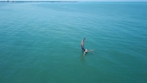Single sail boat in the ocean at Negombo Stock Footage 105602012