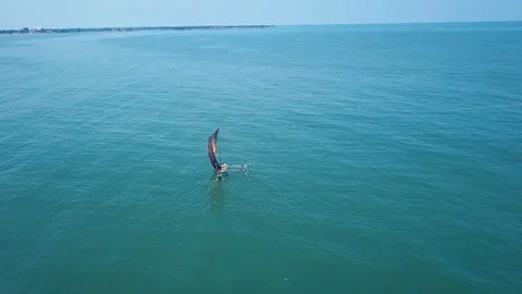 Single sail boat in the ocean in Negombo Stock Footage 105603890