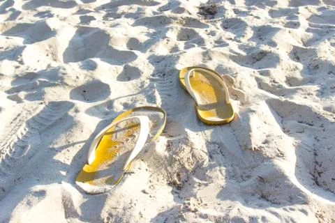 Single sandal on the beach Stock Photos