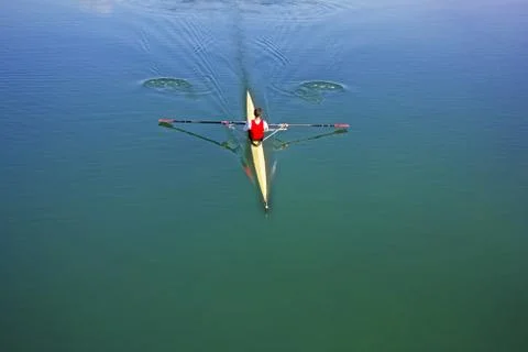 Single scull rowing competitor, rowing race one rower Stock Photos