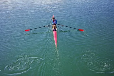 Single scull rowing competitor, rowing race one rower Stock Photos