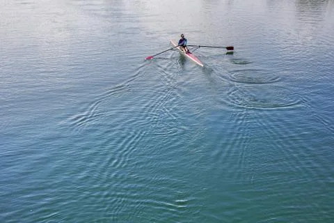 Single scull rowing competitor, rowing race one rower Stock Photos