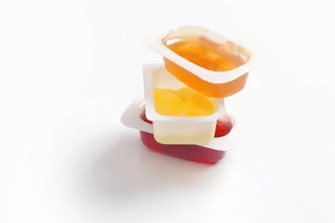 A single serving of honey and jam in the plastic Foto stock