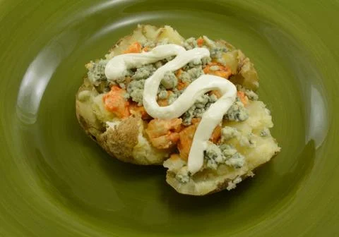 Single serving of stuffed baked potato Stock Photos