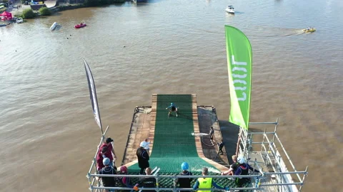 A single skier glides down a river ski jump ramp and performs acrobatic 動画素材 182072361