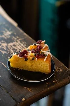 Single Slice of Cake on Rustic Tabletop with Natural Light. Stock Photos