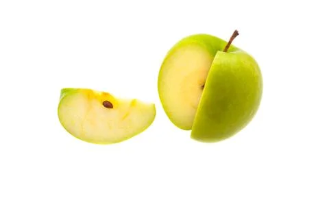 A single slice of a large green apple was cut off. On a white background. Stock Photos