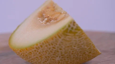 Single Slice Of Melon Rotating on White Background. Fresh, Slice 스톡 동영상 128315394