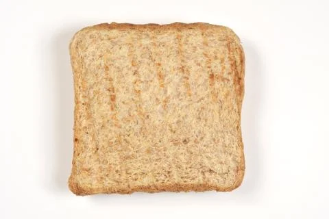 Single slice of whole wheat toast isolated on white background 库存照片