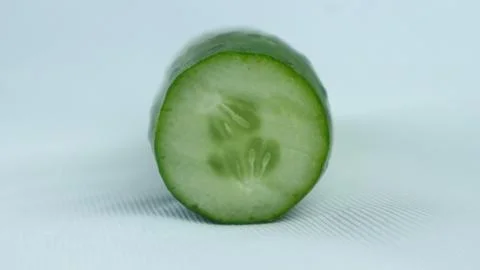 Single sliced cucumber isolated on white background Stock Photos