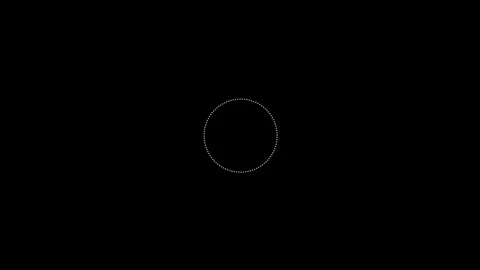 A single small white circle centered in a vast expanse of pure black space Video stock 335117301