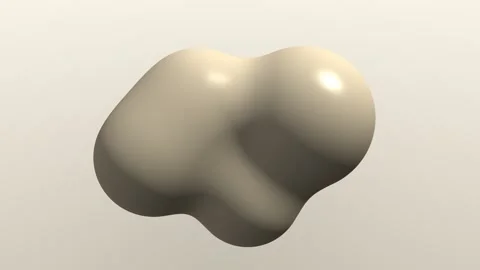 A single smooth beige blob with a glossy finish floating against a clean li.. Stock Footage 347244026