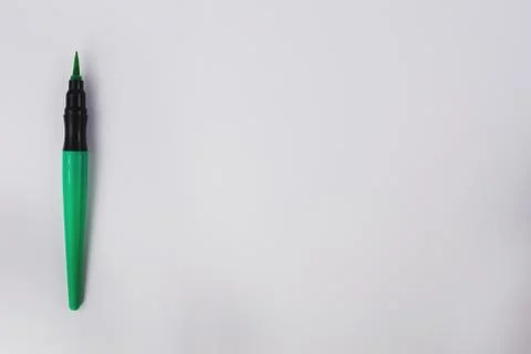 Single smooth green marker brush on white background with copy space Stock Photos
