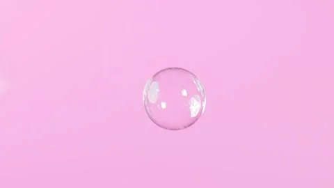 Single soap bubble flies up on a pink background Stock Footage 309004973