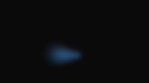 A single soft blue glowing orb floating against a deep black background 스톡 동영상 339619229