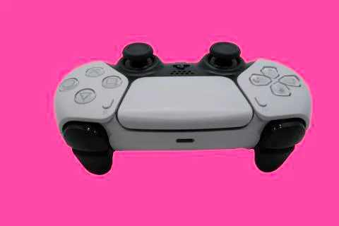 Single Sony Playstation 5 DualSense Control with a pink background Stock Photos
