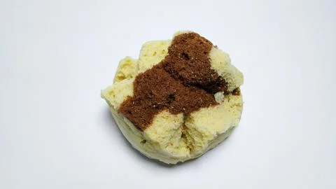 A single steamed sponge cake with a chocolate topping. Stock-Fotos