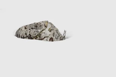 Single stone in the snow Stock Photos
