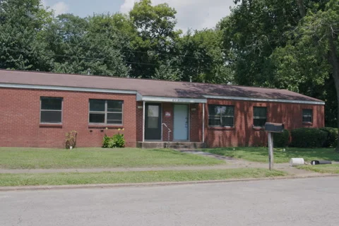 Single Story Red Brick House on Sunny Day Vidéo 342159461