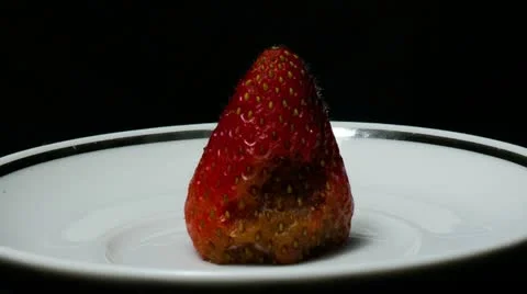 Single strawberry front close up Stock Footage 21881100