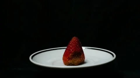 Single strawberry front wide Stock Footage 21881085