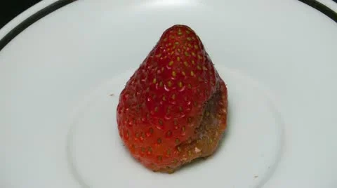 Single strawberry top view close up Stock Footage 21881310