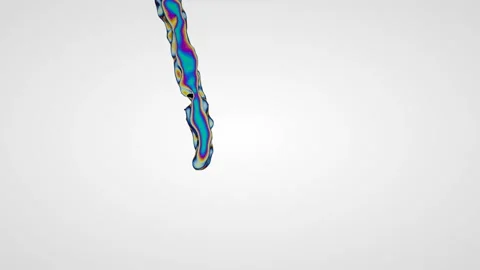 A single stream of multi-colored liquid pours on a white background. 库存影片 122130532