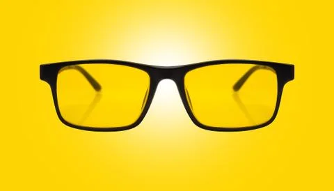 Single sunglasses with black plastic frame and yellow glass 库存照片