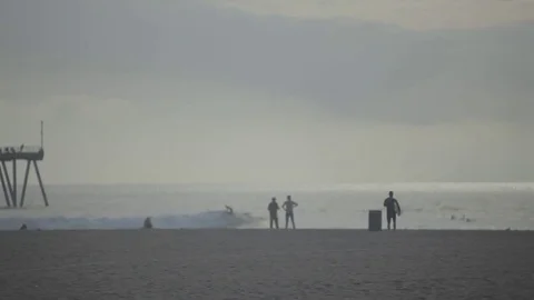 Single Surfer Running Toward Horizon with Surfboard To Go Surfing Stock Footage 74721226