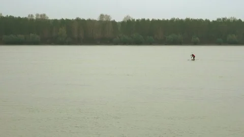 Single surfer supping on the surfboard Stock Footage 112435624