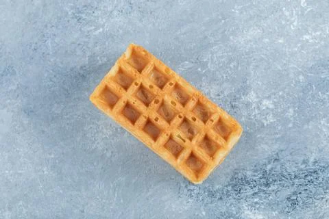 Single sweet waffle on marble background Stock Photos