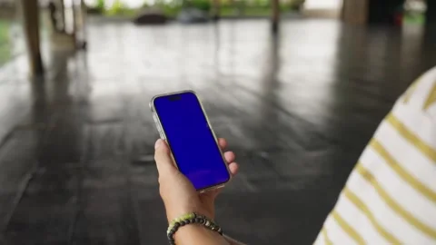 Single Tapping and Holding a Chromakey Screen Smartphone at yoga spase, Workout Video stock 267814156