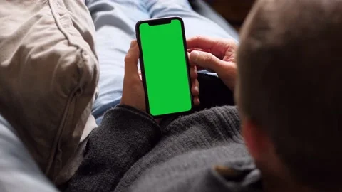 Single Tapping and Holding a Green Screen Smartphone Stock Footage 141215830