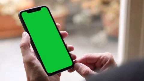 Single Tapping and Holding a Green Screen Smartphone Stock Footage 141216973