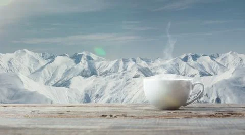Single tea or coffee cup and landscape of mountains on background Fotos Stock