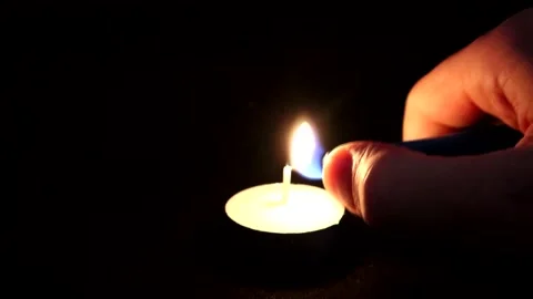 A Single Tealight candle Being Lit 스톡 동영상 132279821