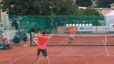 Single Tennis Player Against Two On The Courte Stock Footage 89210935